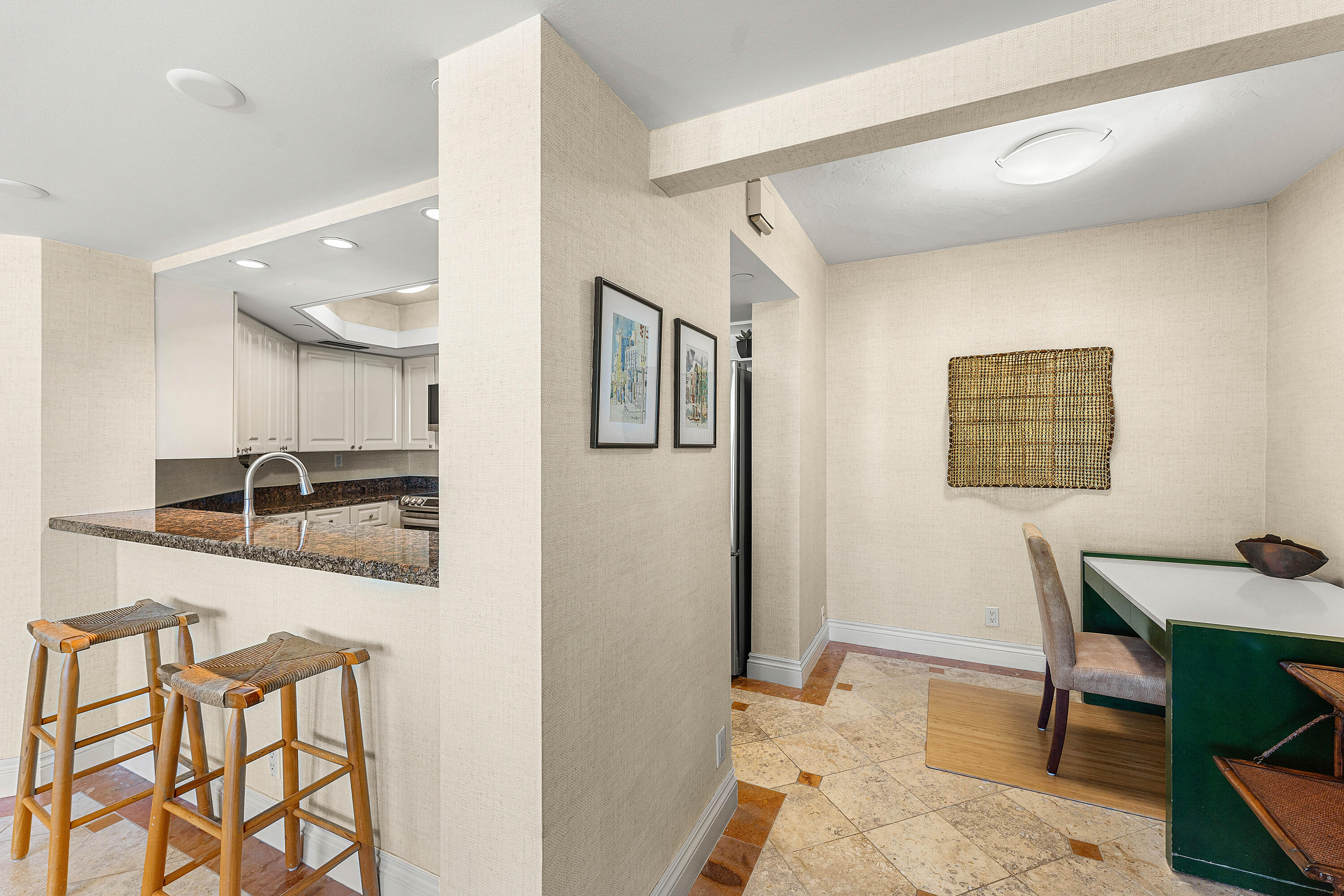 100 Southeast 5th Avenue, Unit 410 Boca Raton, FL 33432 - Photo 18 of 63 a hallway with a table and chairs in it