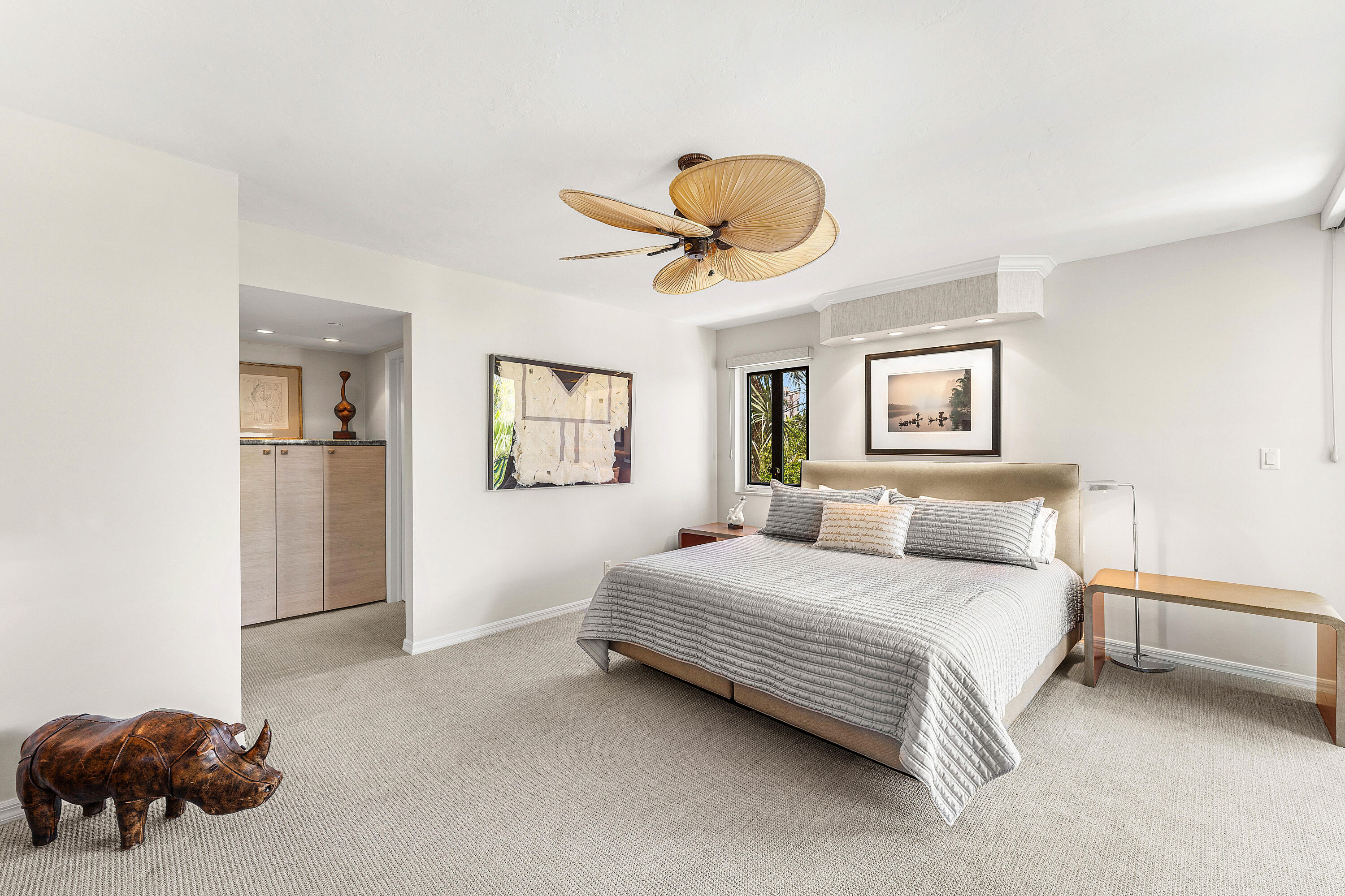 100 Southeast 5th Avenue, Unit 410 Boca Raton, FL 33432 - Photo 22 of 63 a bedroom with a bed and a chandelier