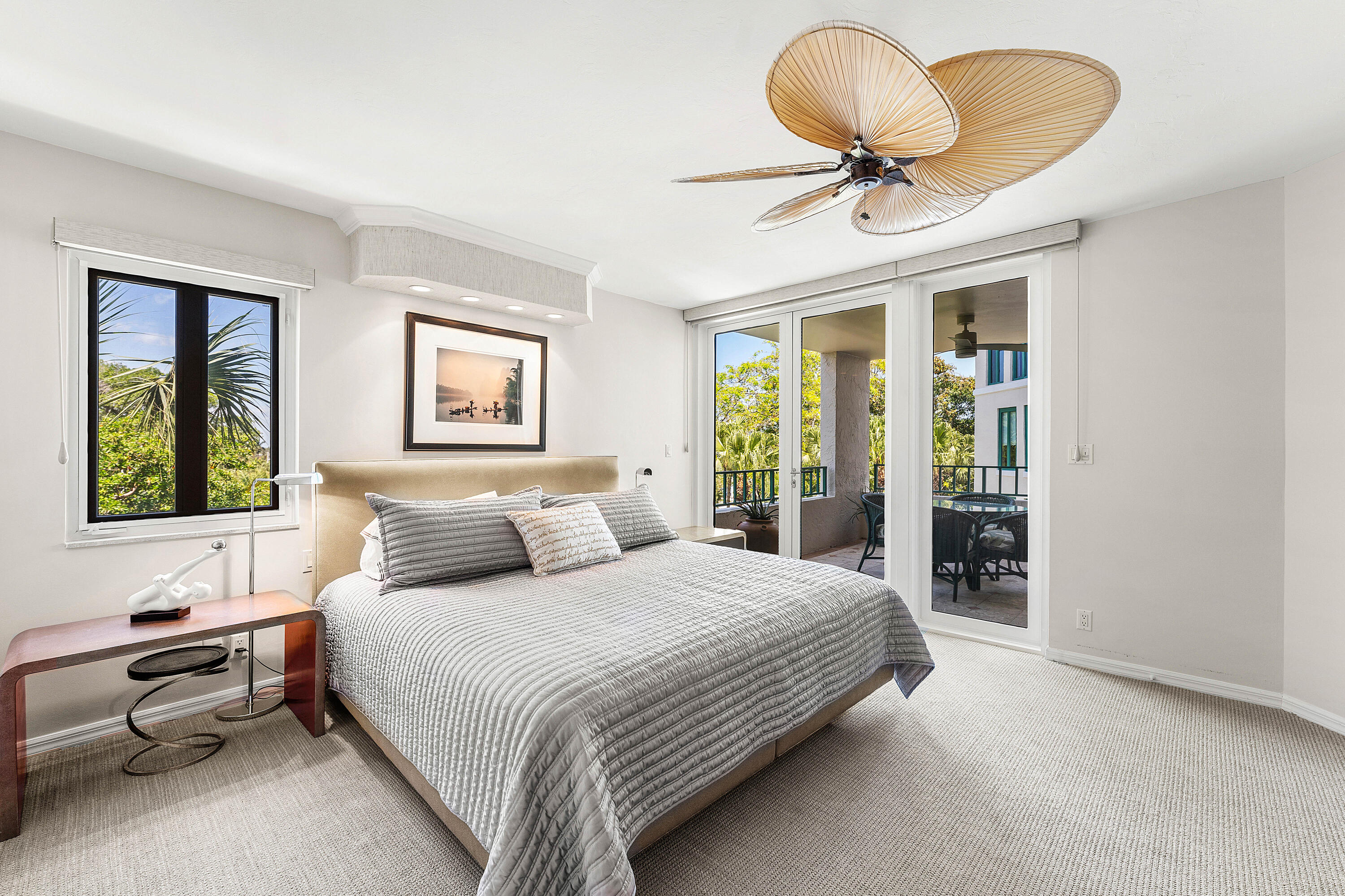 100 Southeast 5th Avenue, Unit 410 Boca Raton, FL 33432 - Photo 23 of 63 a bedroom with a bed and a chandelier