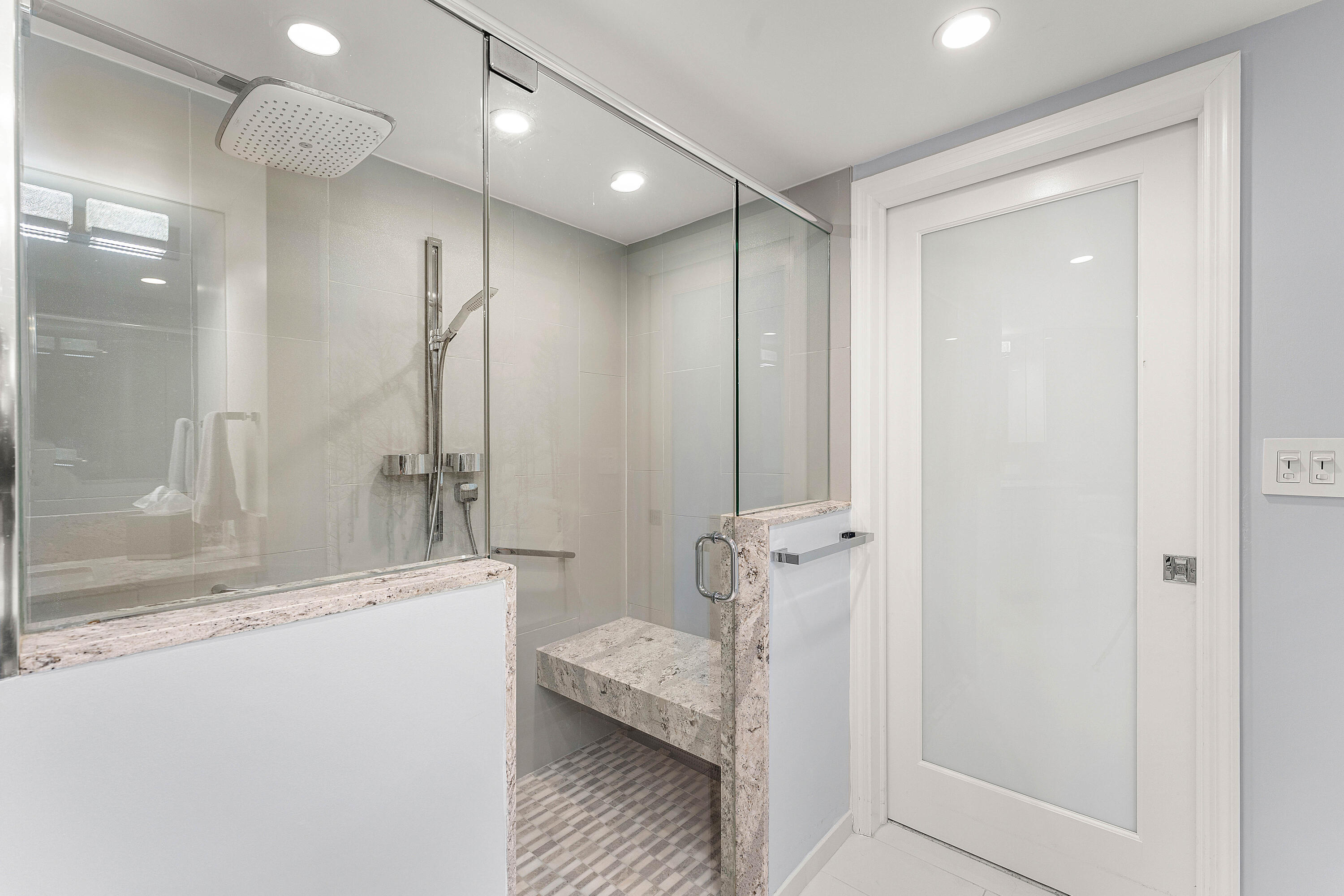 100 Southeast 5th Avenue, Unit 410 Boca Raton, FL 33432 - Photo 27 of 63 a bathroom with a shower and a tub