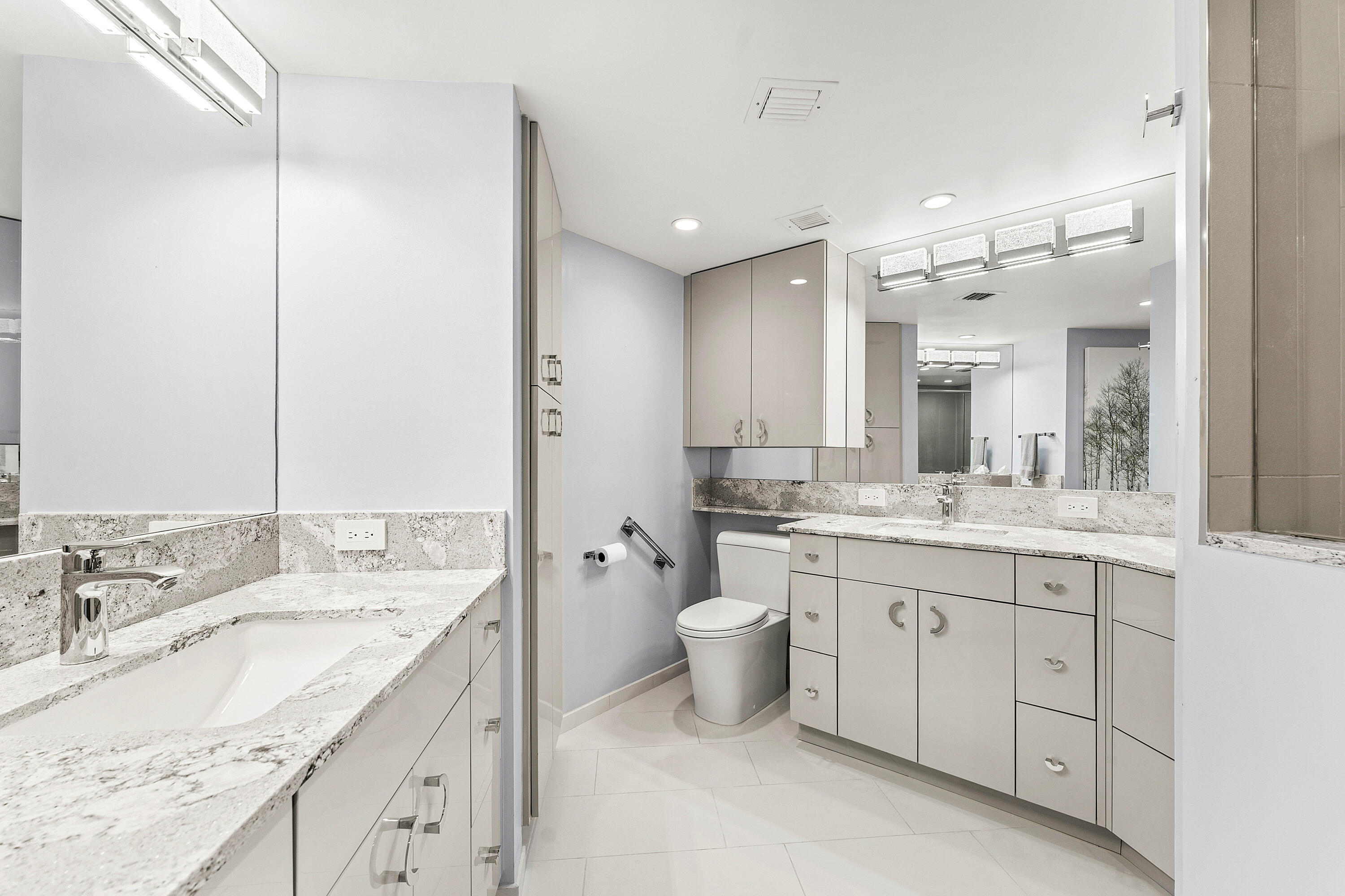 100 Southeast 5th Avenue, Unit 410 Boca Raton, FL 33432 - Photo 28 of 63 a bathroom with a granite countertop sink double and mirror