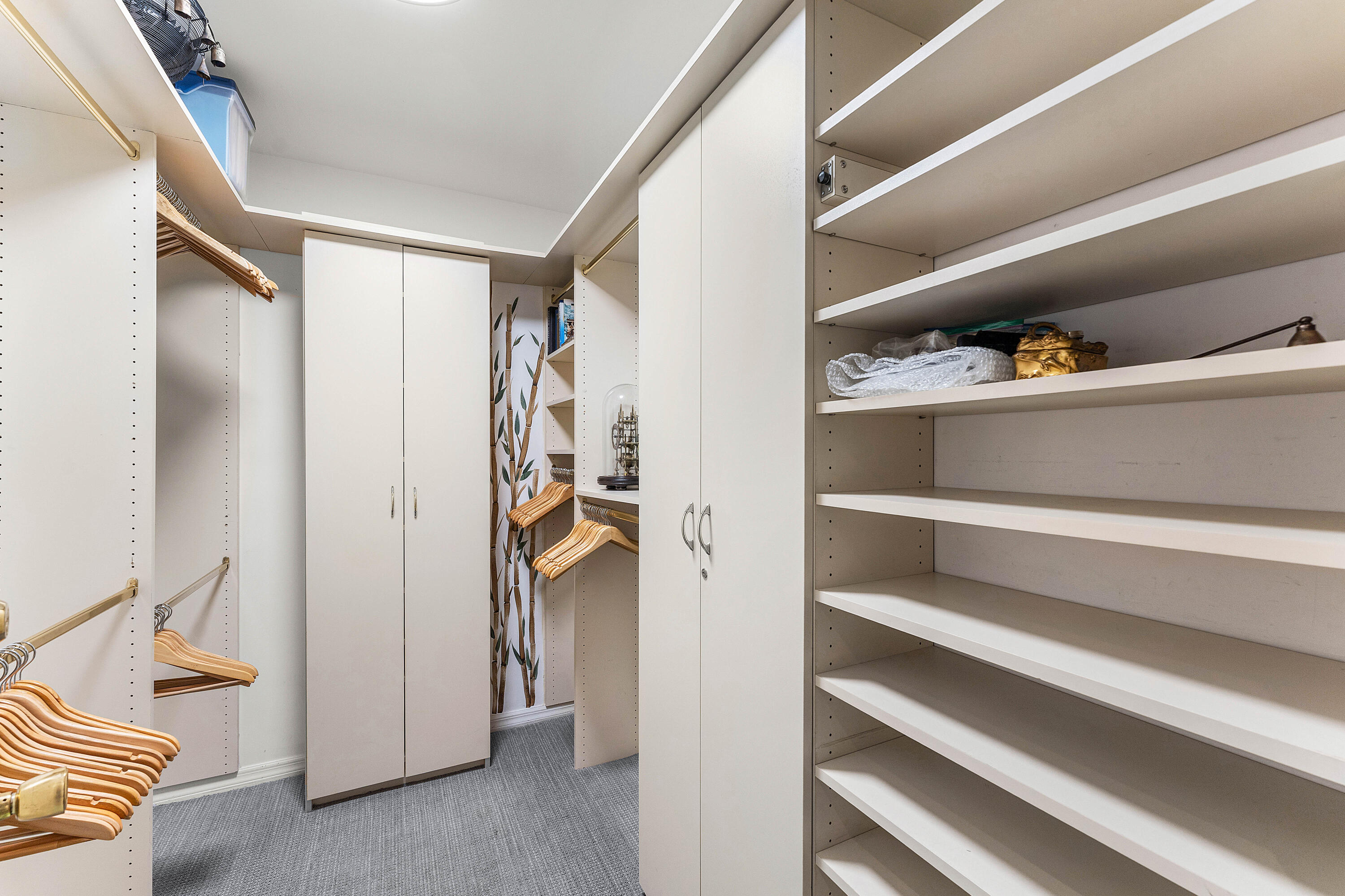 100 Southeast 5th Avenue, Unit 410 Boca Raton, FL 33432 - Photo 31 of 63 a view of walk in closet with clothes and shoes