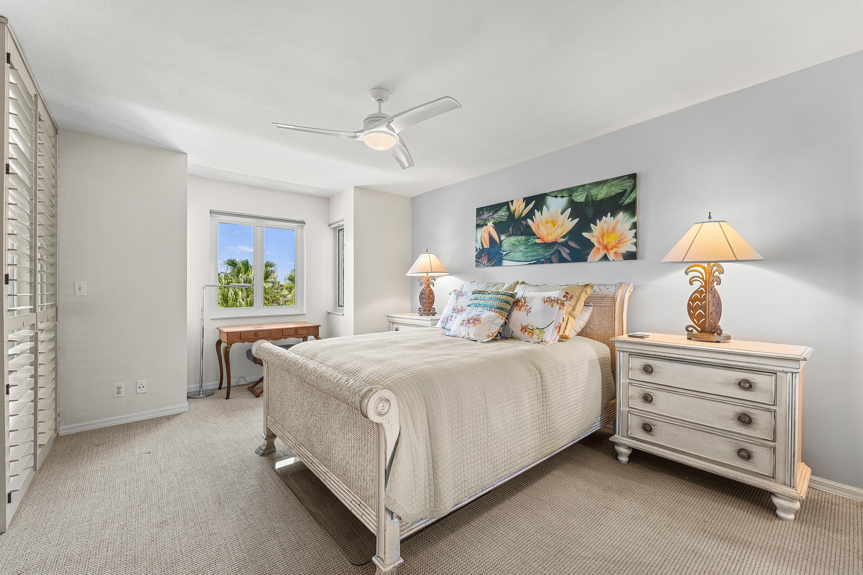 100 Southeast 5th Avenue, Unit 410 Boca Raton, FL 33432 - Photo 32 of 63 a bedroom with a bed and a chandelier