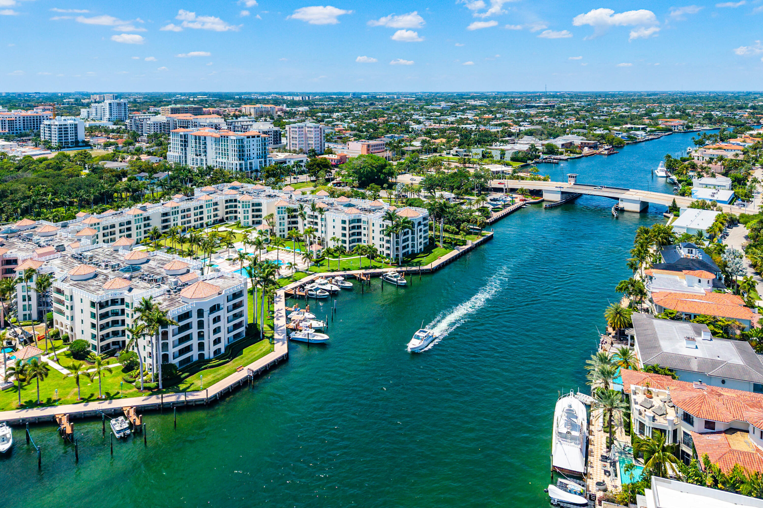 100 Southeast 5th Avenue, Unit 410 Boca Raton, FL 33432 - Photo 50 of 63 a view of a city with lots of residential buildings ocean and lots of trees in the background