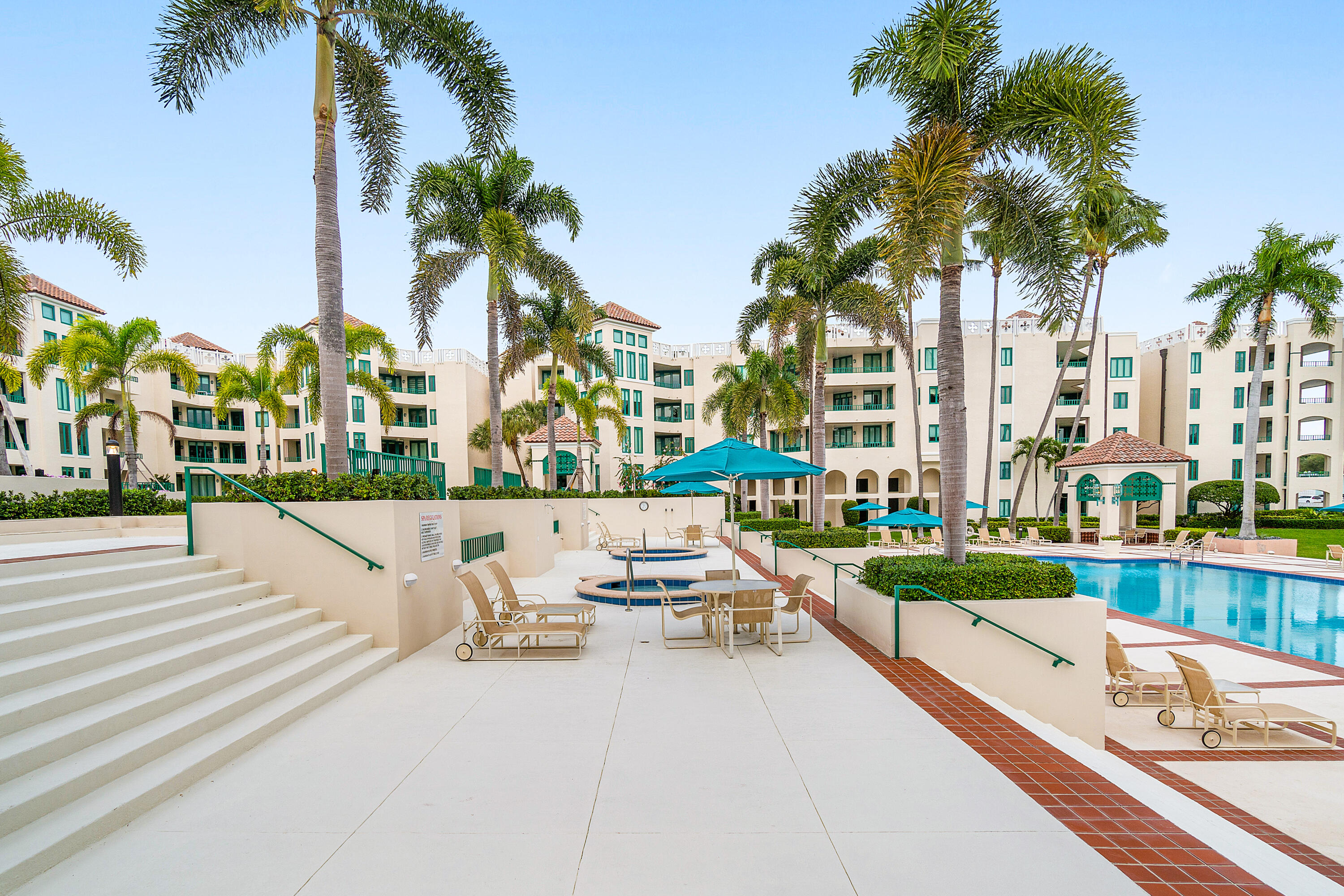100 Southeast 5th Avenue, Unit 410 Boca Raton, FL 33432 - Photo 56 of 63 a view of swimming pool with a yard and palm trees
