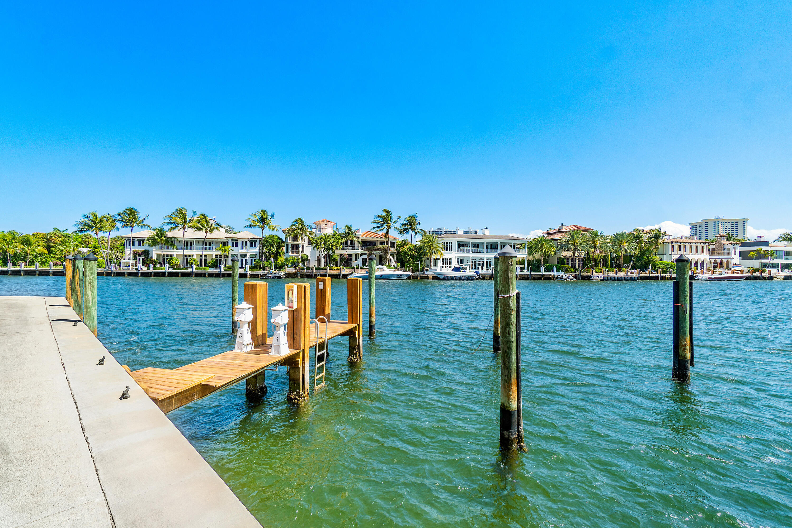 100 Southeast 5th Avenue, Unit 410 Boca Raton, FL 33432 - Photo 59 of 63 a view of a lake with boats and trees in the background