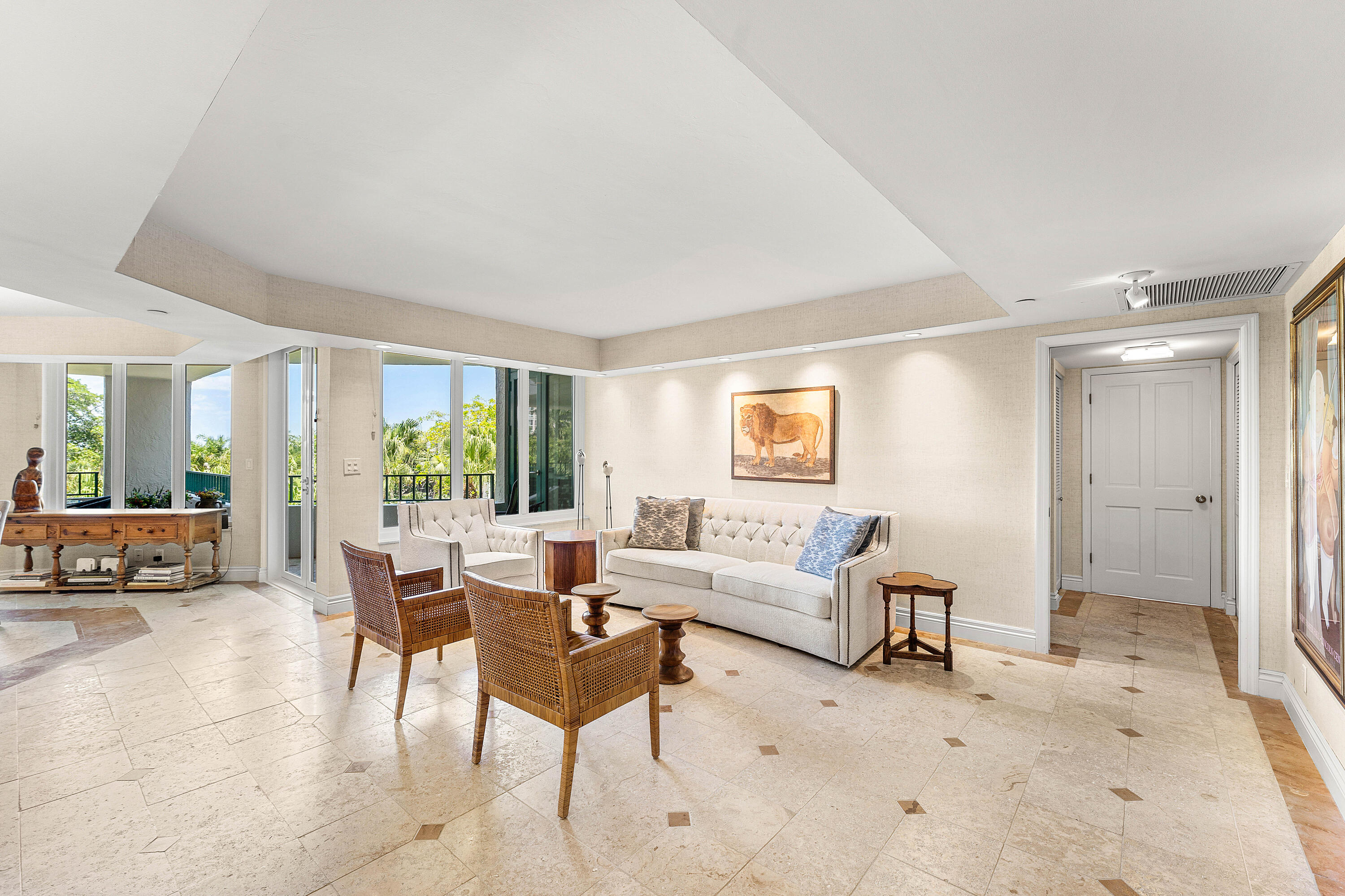 100 Southeast 5th Avenue, Unit 410 Boca Raton, FL 33432 - Photo 7 of 63 a living room with furniture and a table