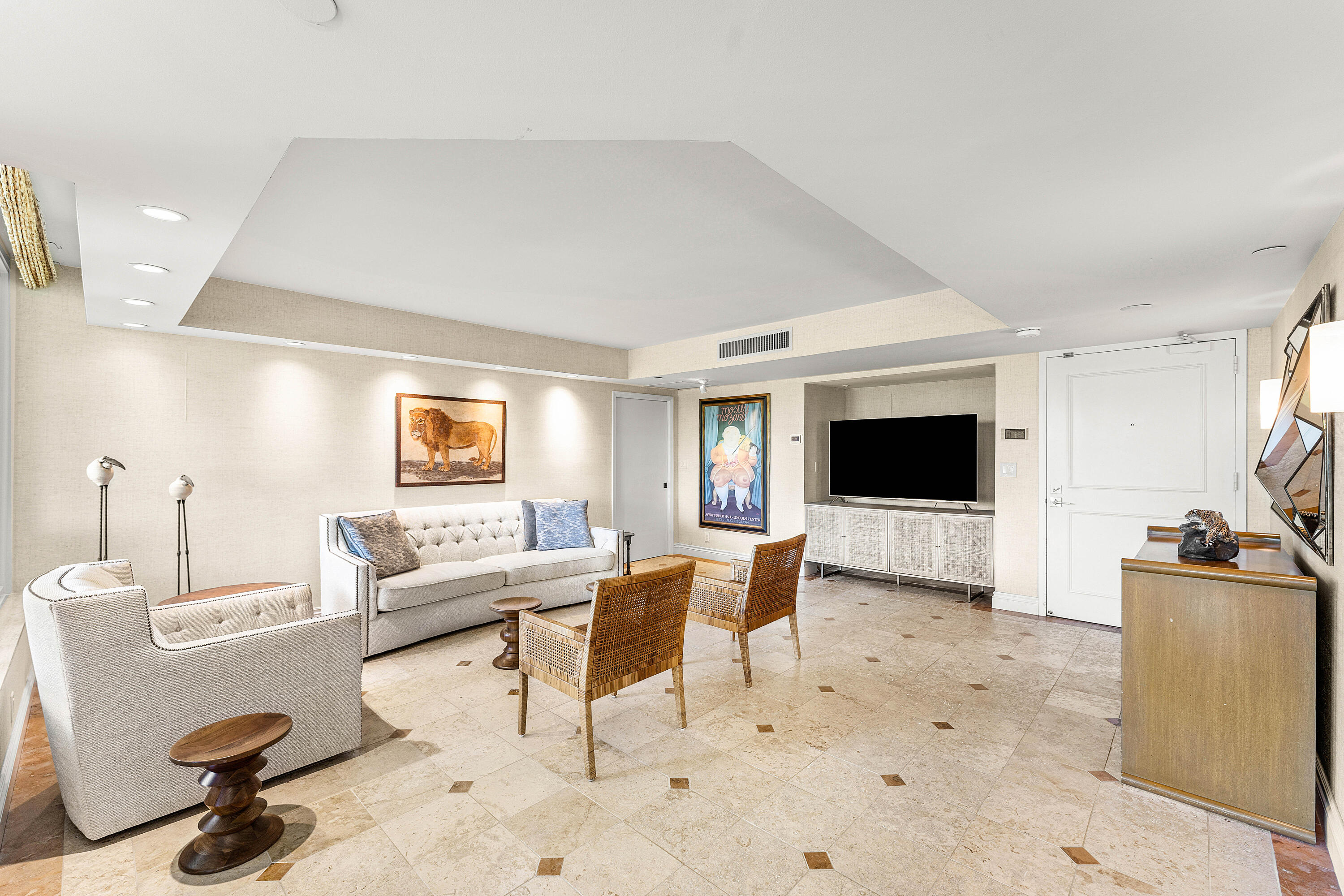 100 Southeast 5th Avenue, Unit 410 Boca Raton, FL 33432 - Photo 9 of 63 a living room with furniture and a flat screen tv
