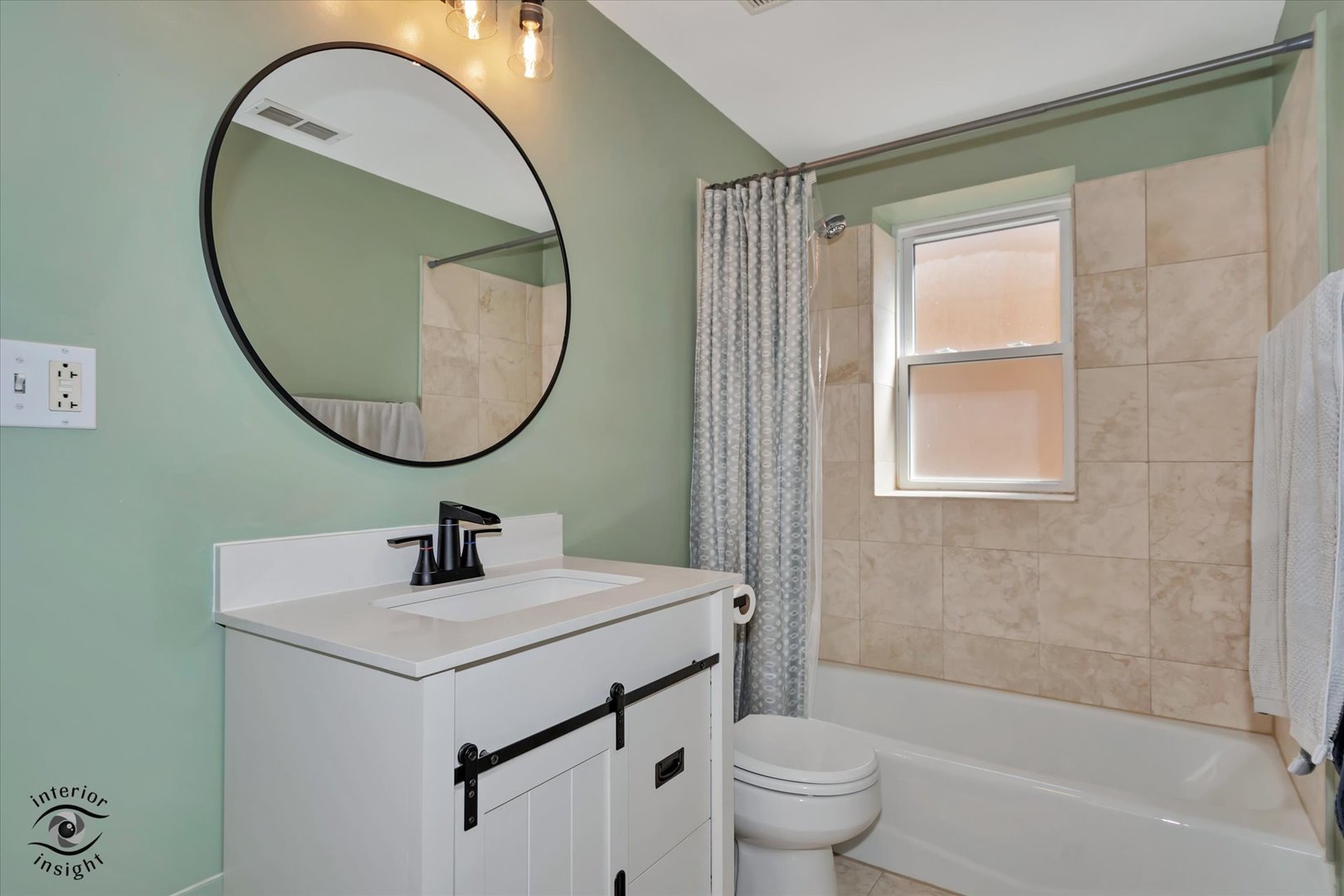 2537 Prairie Avenue, Unit 2E Evanston, IL 60201 - Photo 15 of 21 a bathroom with a sink a toilet and a mirror