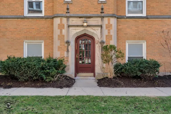 front view of a house with potted plants
