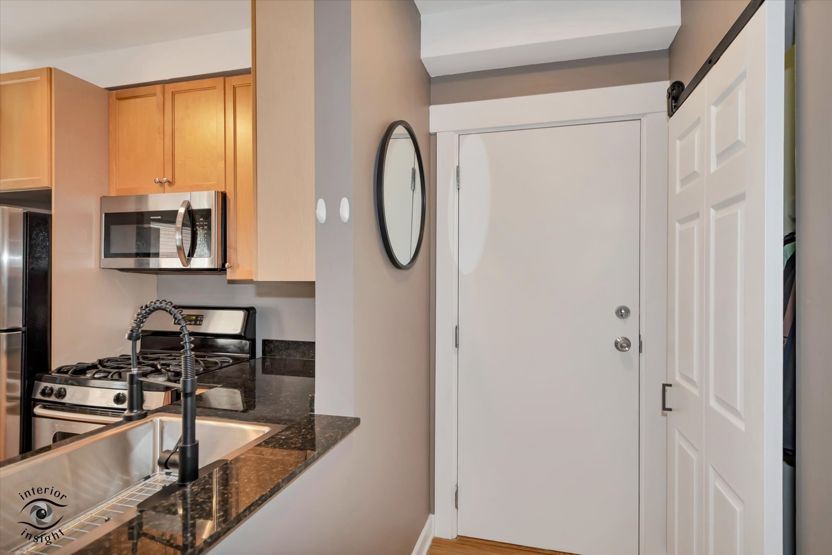 2537 Prairie Avenue, Unit 2E Evanston, IL 60201 - Photo 5 of 21 a kitchen with stainless steel appliances granite countertop a sink and a refrigerator