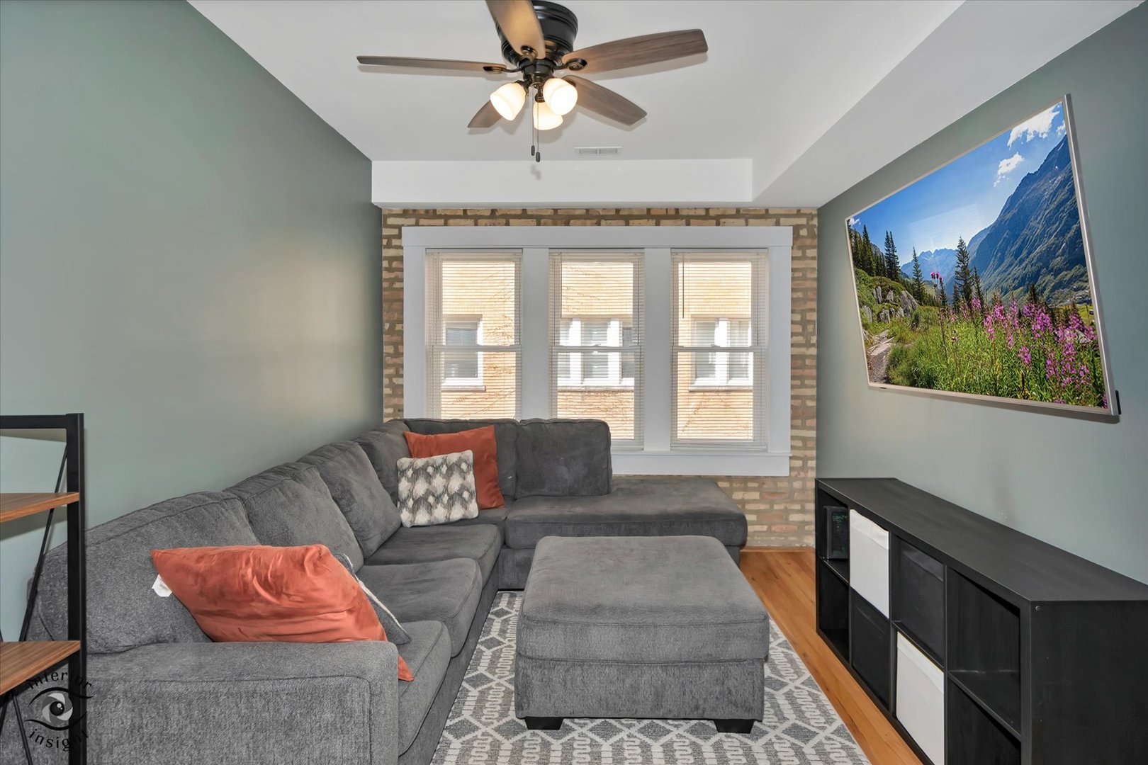 2537 Prairie Avenue, Unit 2E Evanston, IL 60201 - Photo 7 of 21 a living room with furniture and a chandelier