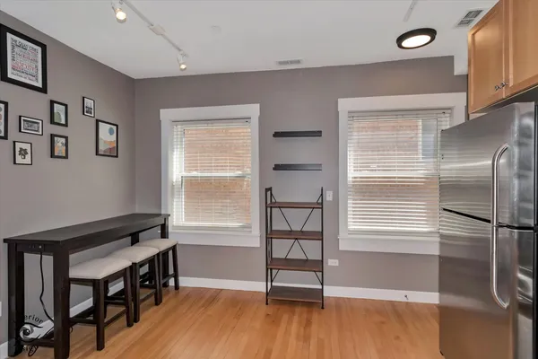 a view of a livingroom with furniture and a window