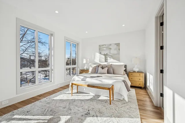 a bedroom with a bed and a night stand