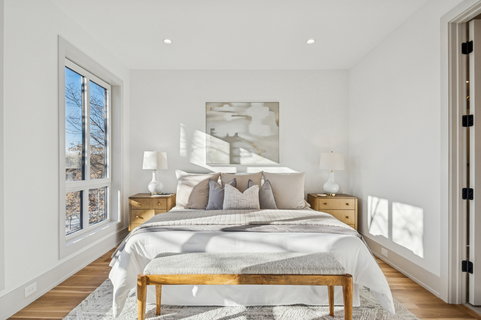 2246 West Lyndale Street, Unit 2 Chicago, IL 60647 - Photo 18 of 27 a bedroom with a bed and a night stand