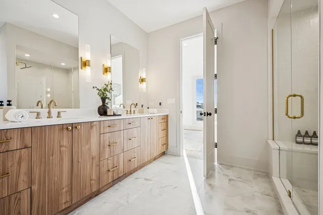 a bathroom with a double vanity sink and a mirror