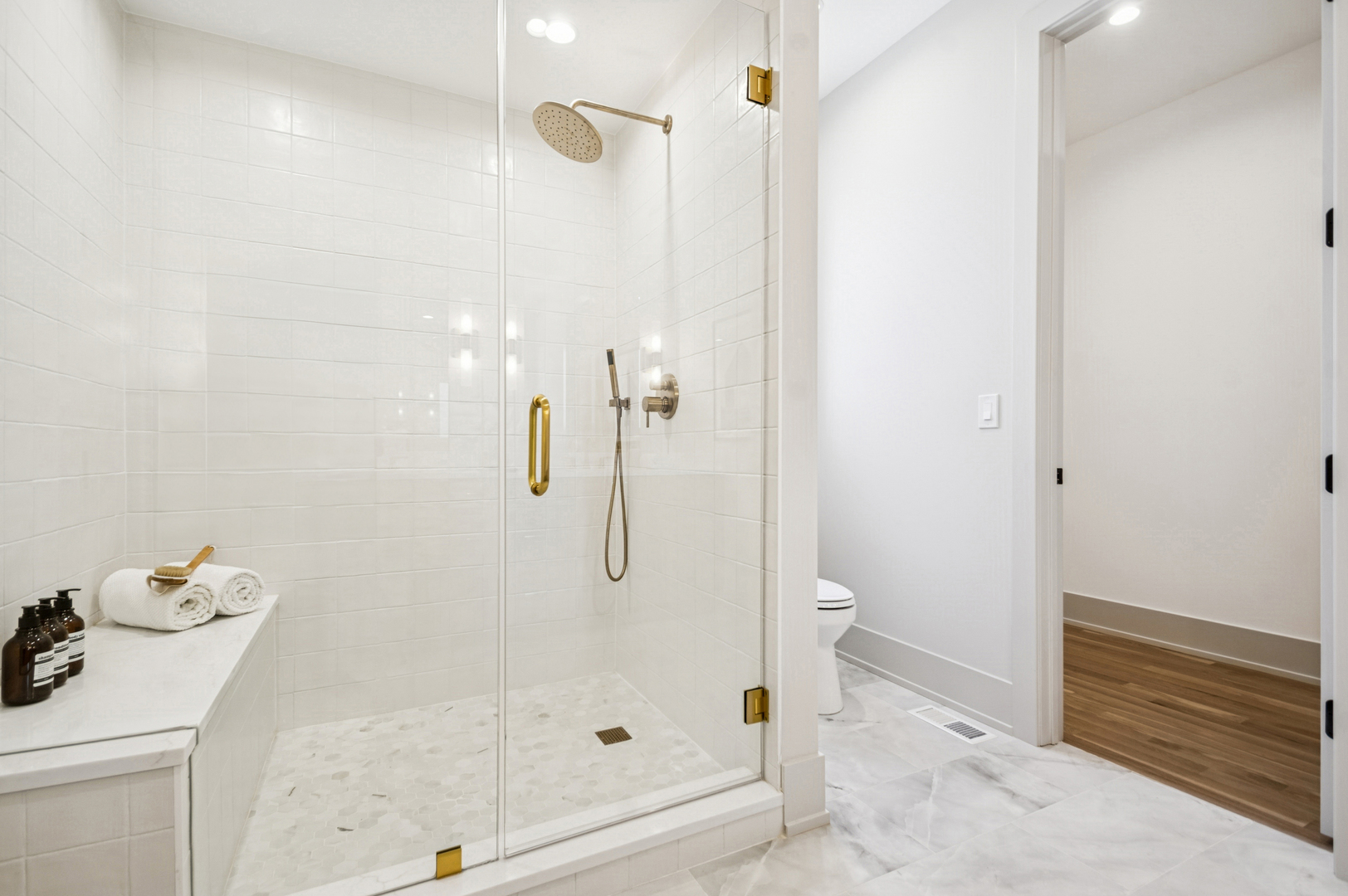 2246 West Lyndale Street, Unit 2 Chicago, IL 60647 - Photo 22 of 27 a bathroom with a granite countertop shower and a sink