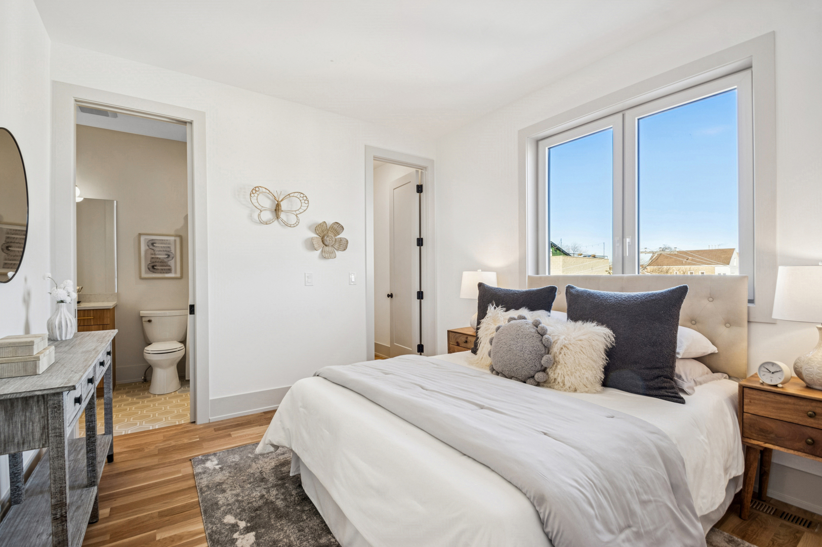 2246 West Lyndale Street, Unit 2 Chicago, IL 60647 - Photo 23 of 27 a bedroom with a bed and wooden floor