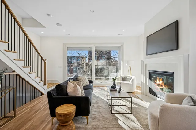 a living room with furniture fireplace and a flat screen tv