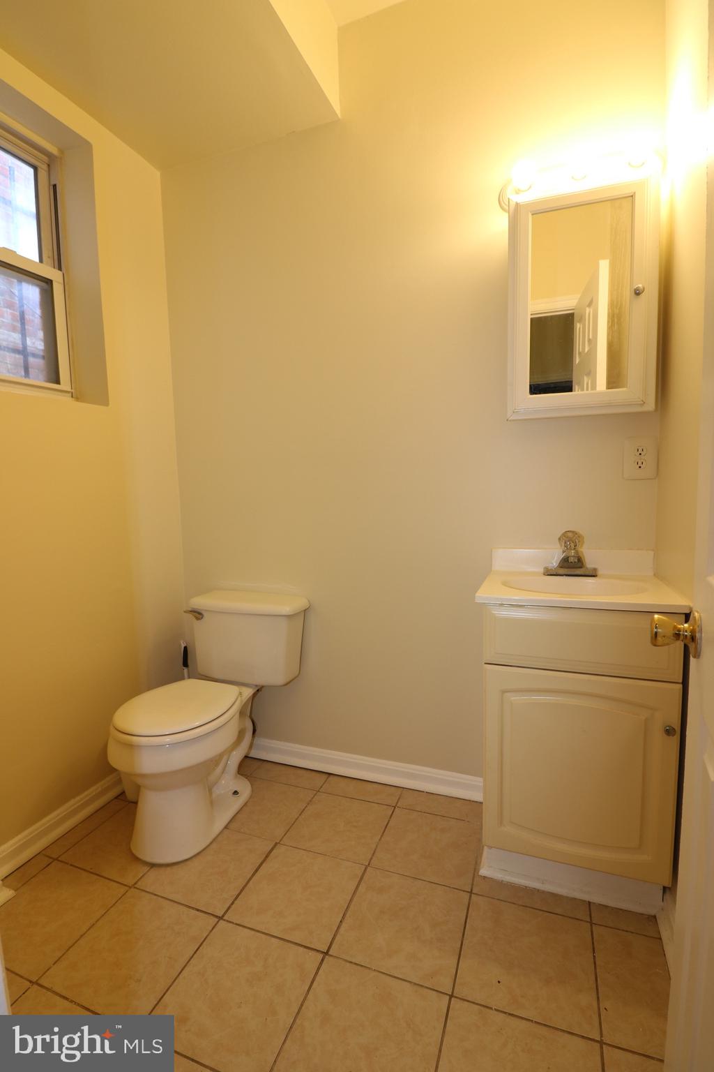 403 O Street Northwest Washington, DC 20001 - Photo 11 of 33 a bathroom with a toilet and a sink