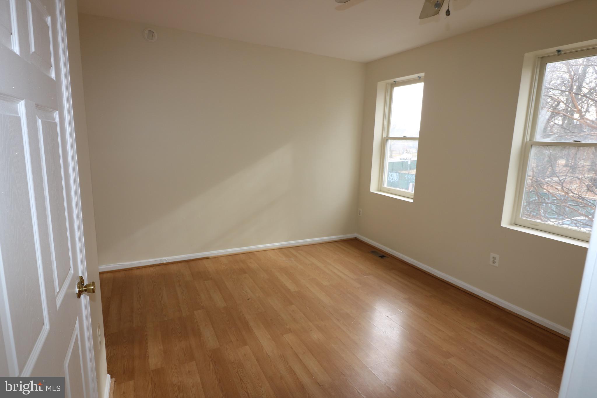 403 O Street Northwest Washington, DC 20001 - Photo 22 of 33 an empty room with wooden floor and windows