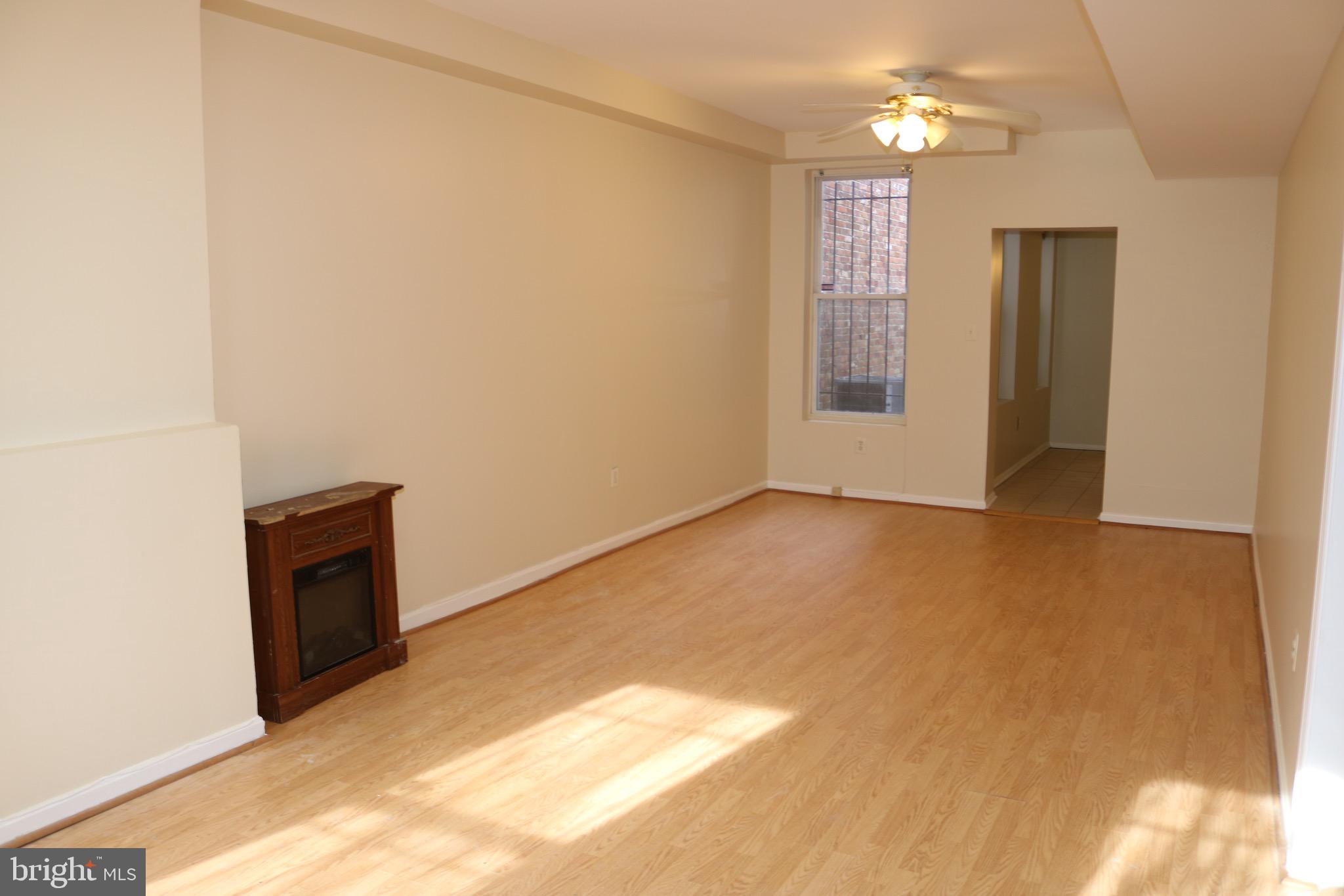 403 O Street Northwest Washington, DC 20001 - Photo 6 of 33 a view of an empty room with a fireplace