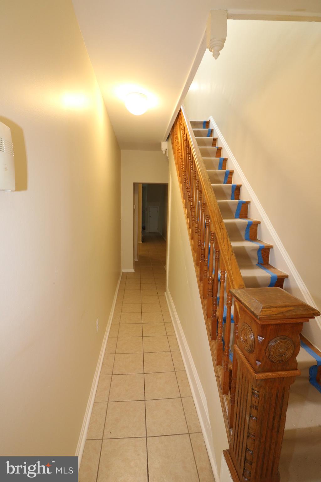 403 O Street Northwest Washington, DC 20001 - Photo 9 of 33 a view of a hallway with wooden floor and staircase