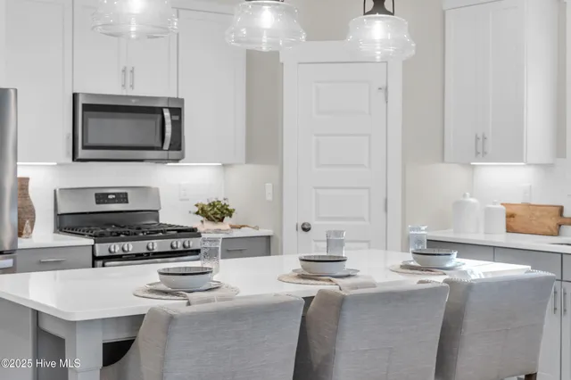 $765,000 | 238 Spicer Lake Drive, Holly Ridge, NC 28445