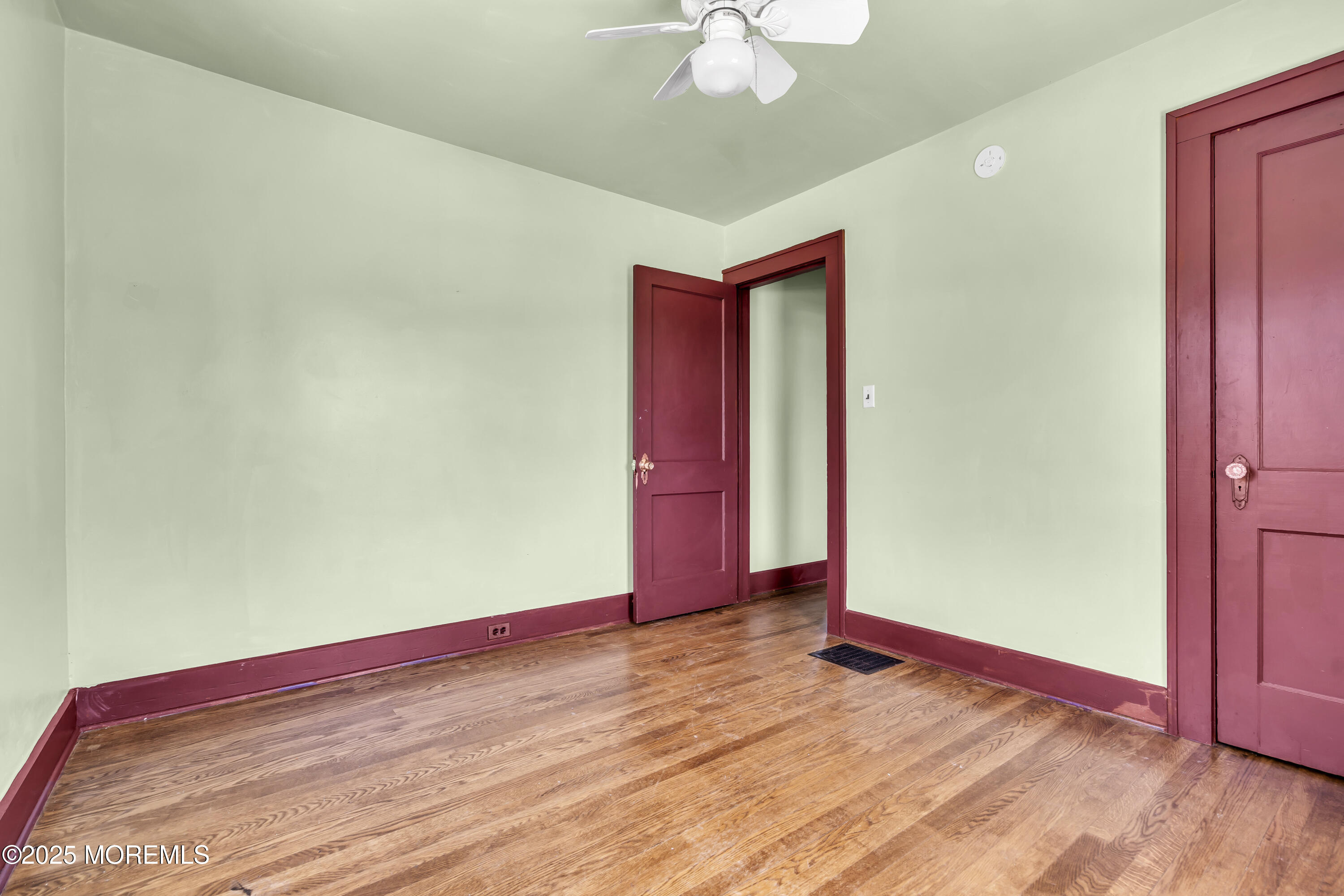189 Mantoloking Road Brick, NJ 08723 - Photo 17 of 38 a view of empty room with wooden floor