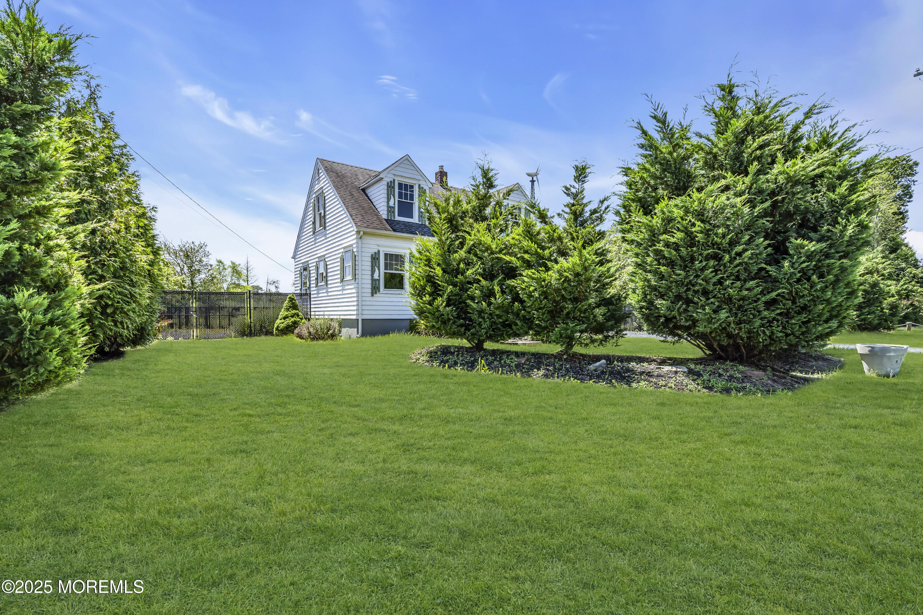 189 Mantoloking Road Brick, NJ 08723 - Photo 3 of 38 a view of a house with a big yard potted plants and large tree