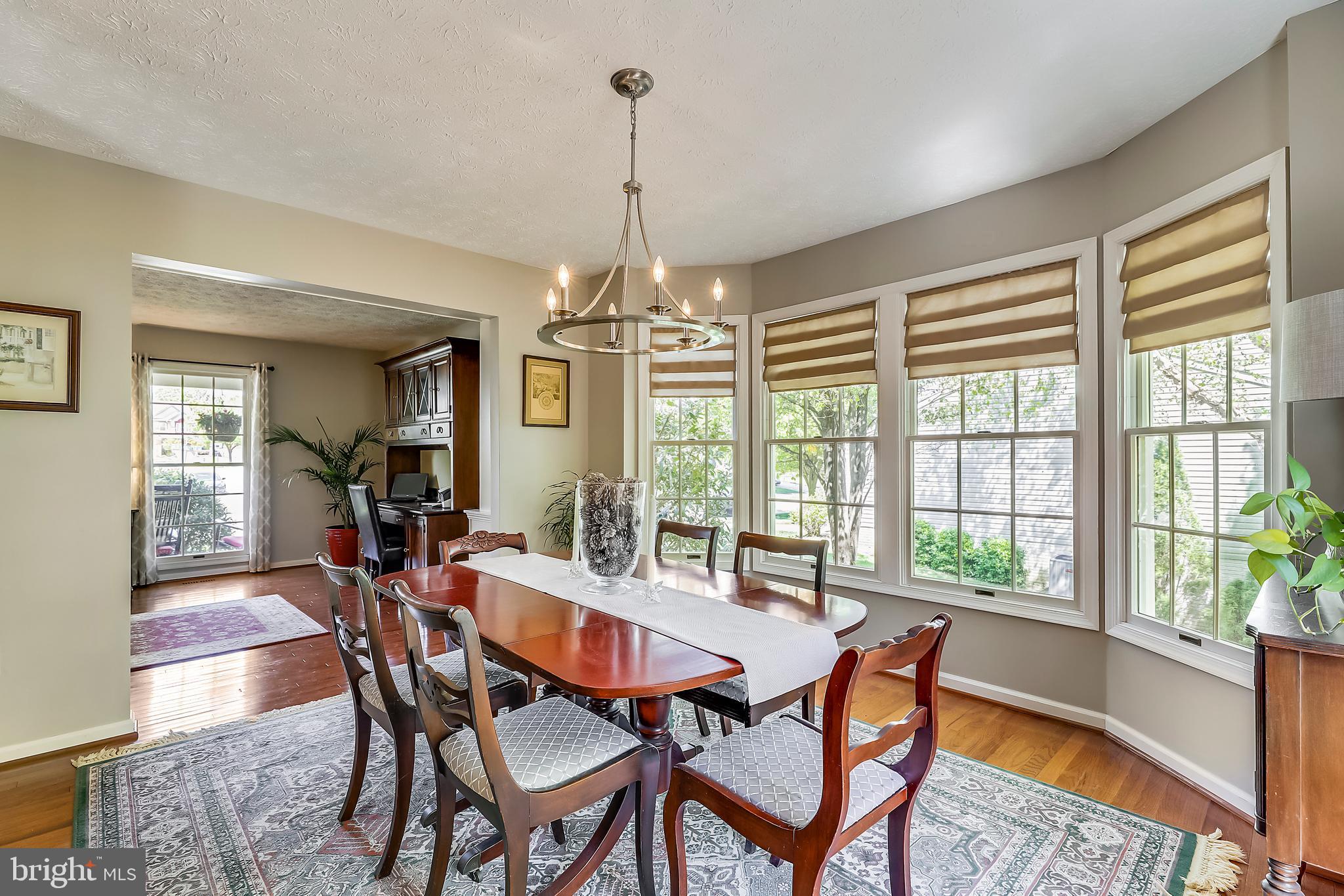 Light-filled Dining Room has 5 Windows & Hardwood!
