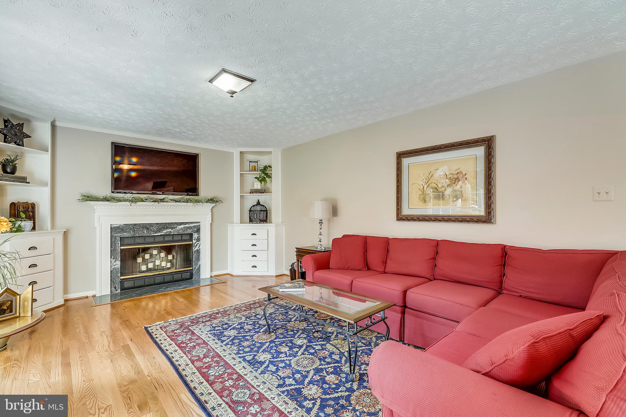 1113 Red Harvest Road Gambrills, MD 21054 - Photo 8 of 35 The large Family Room has Built-ins & a Fireplace