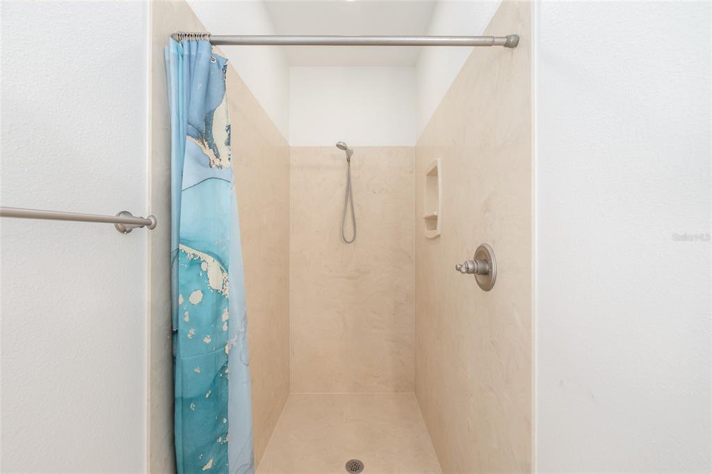 4735 Southeast 112th Street Road Belleview, FL 34420 - Photo 36 of 73 a bathroom with a shower