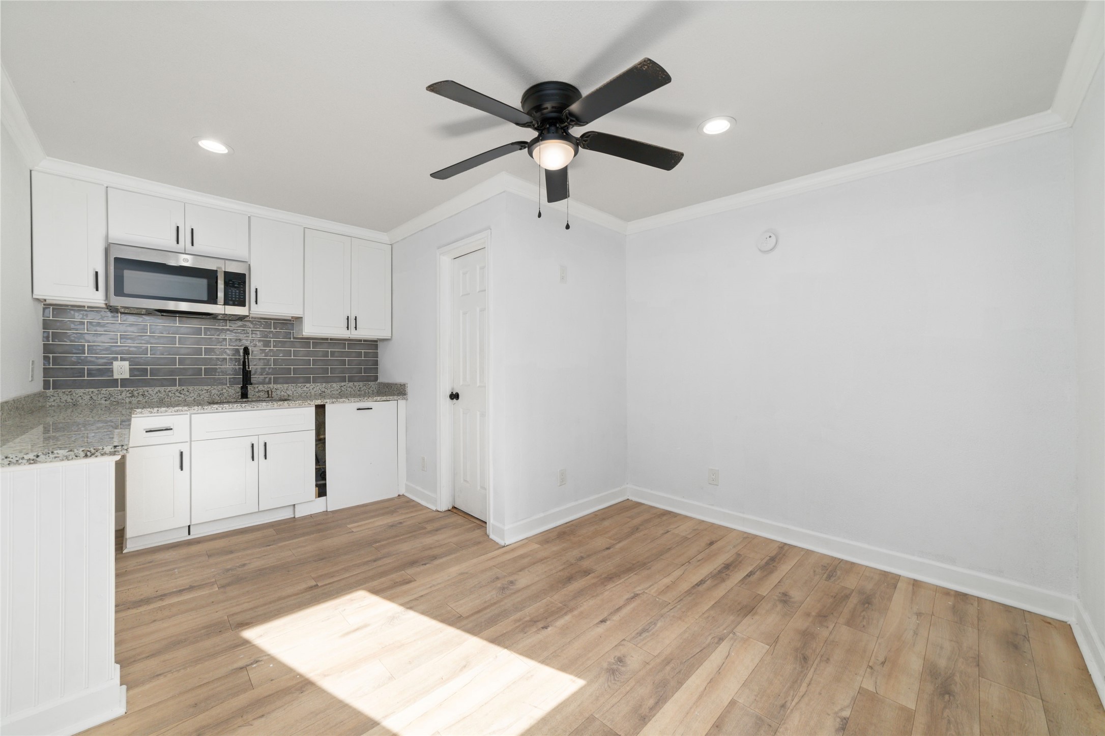 7125 Conley Street Houston, TX 77021 - Photo 21 of 32 A look inside one of the dwellings that has a mini kitchen with a sink and microwave and full bathroom.