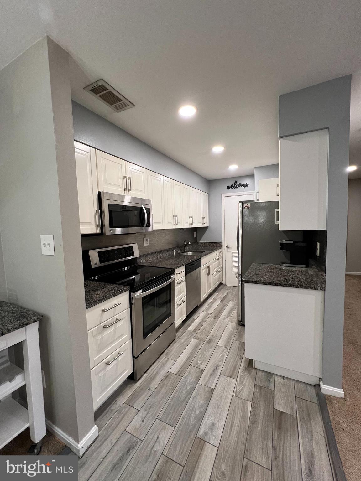 5800 F Torington Drive, Unit 837 Springfield, VA 22152 - Photo 6 of 31 Beauiful remodeled white kitchen
