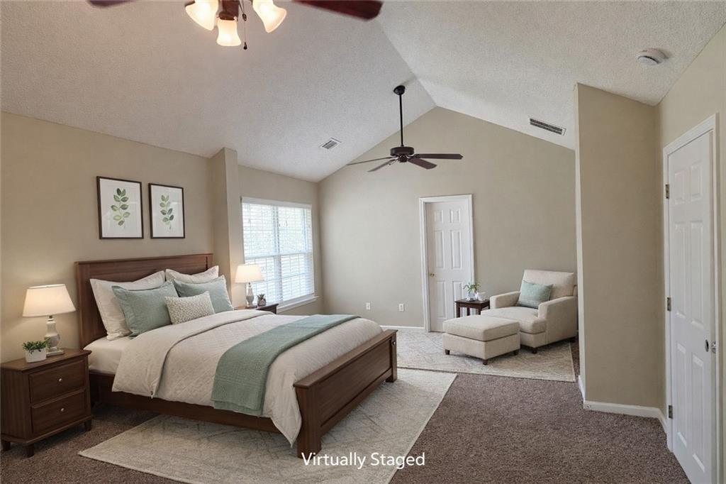 92 Revere Turn Fairburn, GA 30213 - Photo 21 of 42 a bedroom with bed and window
