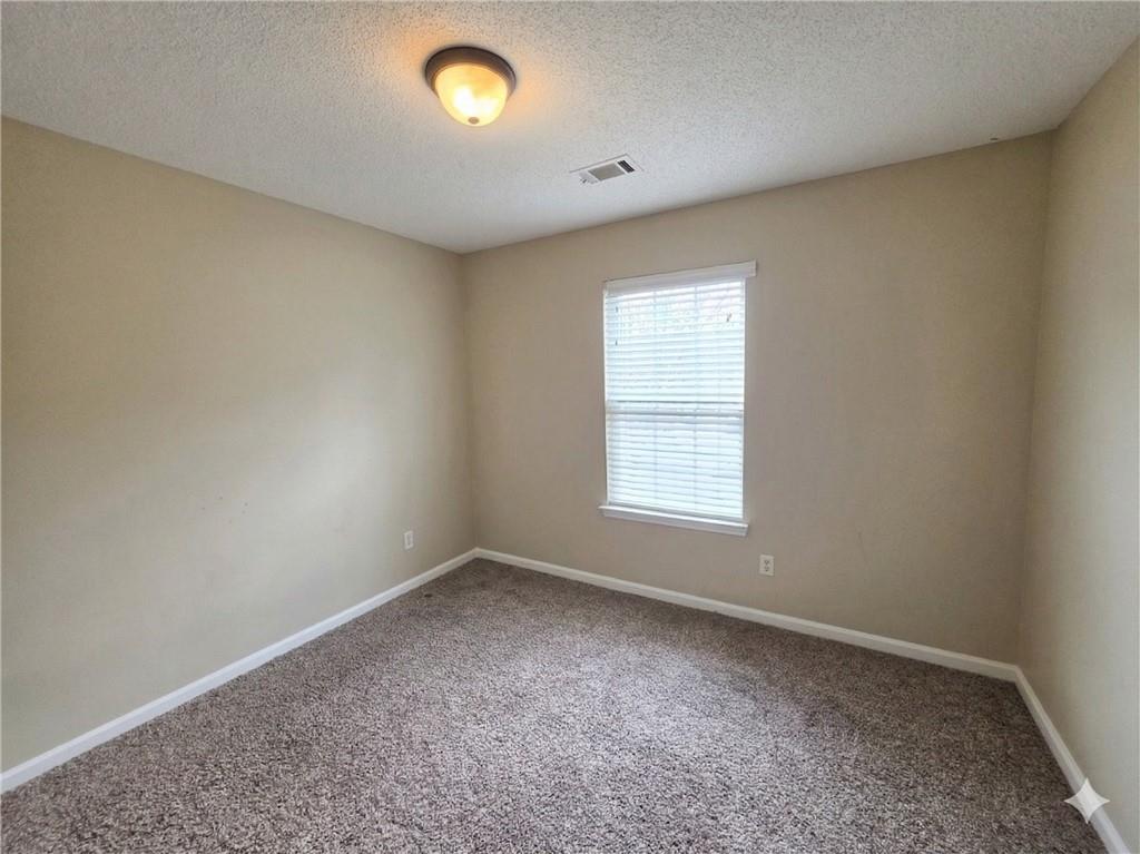 92 Revere Turn Fairburn, GA 30213 - Photo 24 of 42 an empty room with a empty space and window