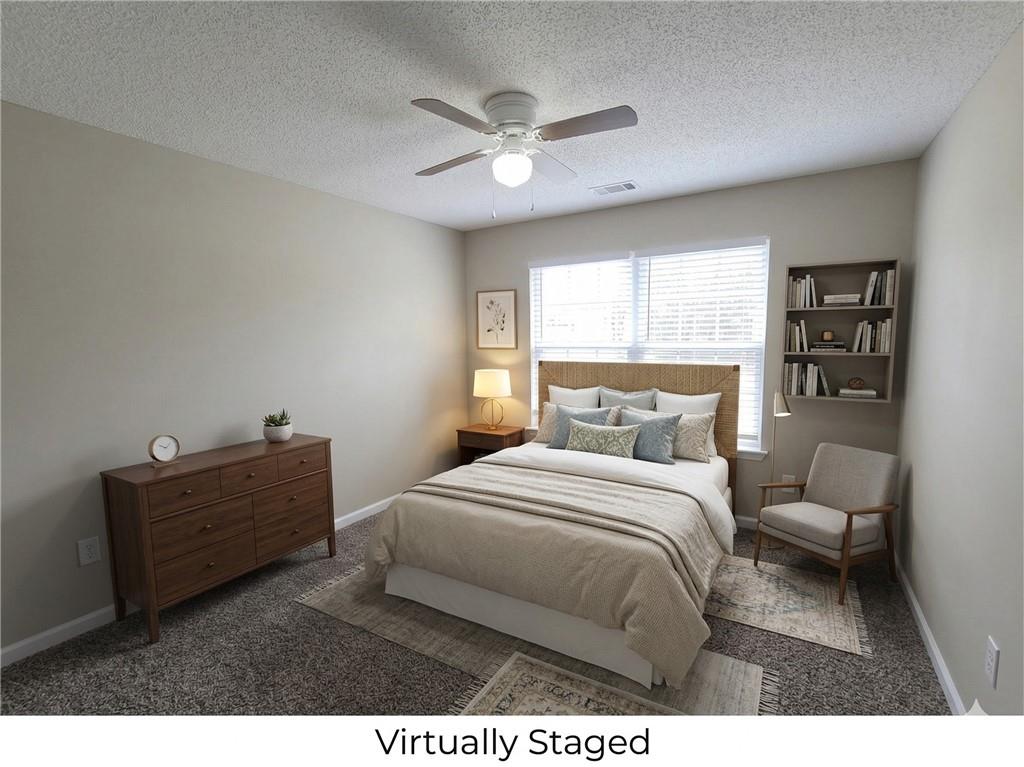 92 Revere Turn Fairburn, GA 30213 - Photo 27 of 42 a bed room with a bed and a window