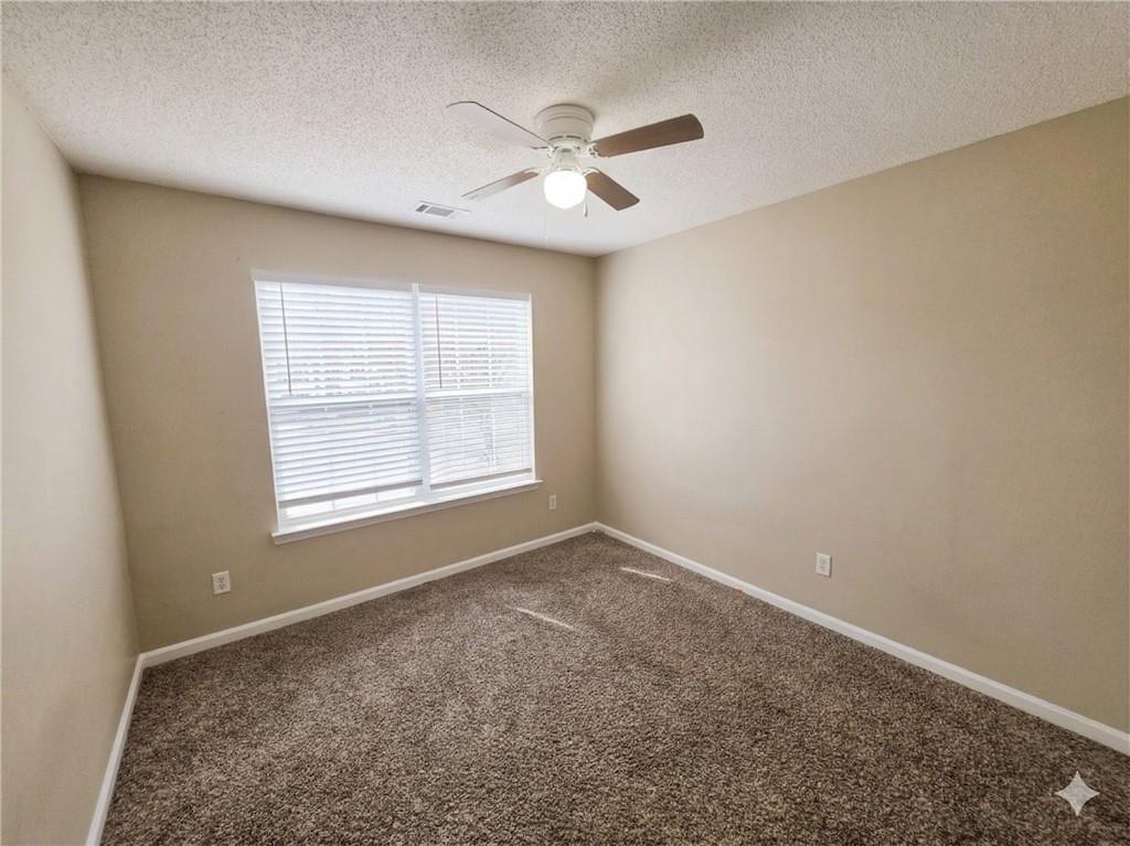 92 Revere Turn Fairburn, GA 30213 - Photo 29 of 42 a view of an empty room with a window