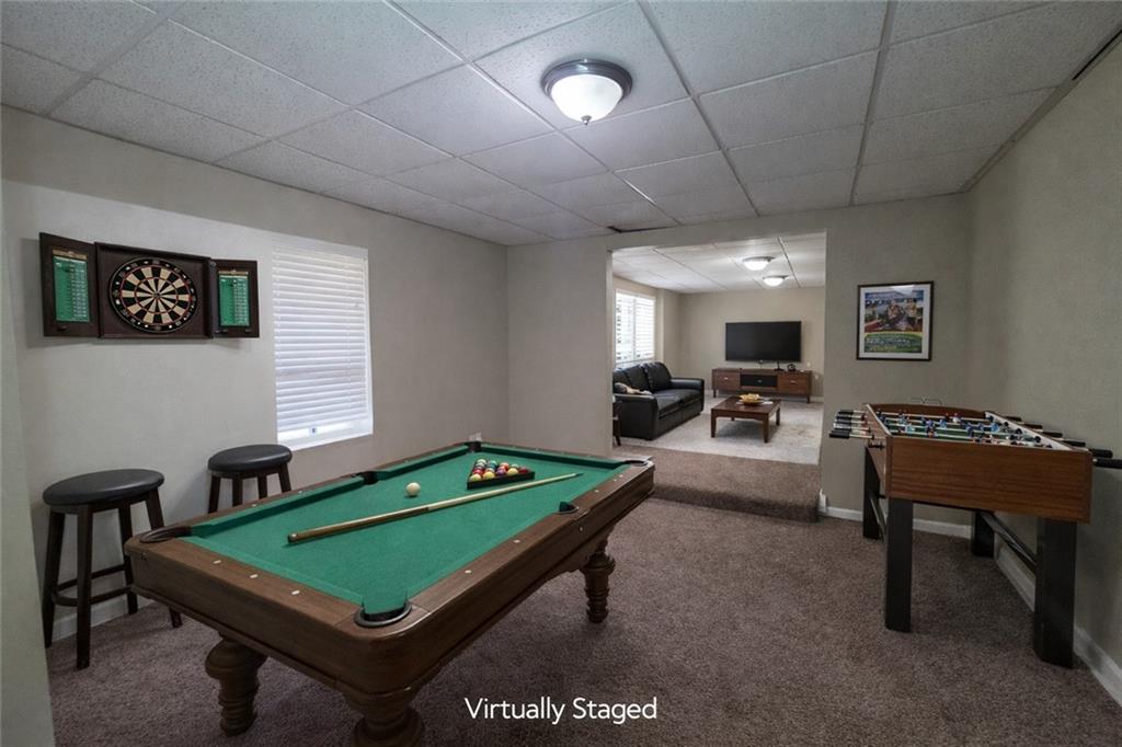 92 Revere Turn Fairburn, GA 30213 - Photo 35 of 42 a room with furniture pool table flat screen tv and a table