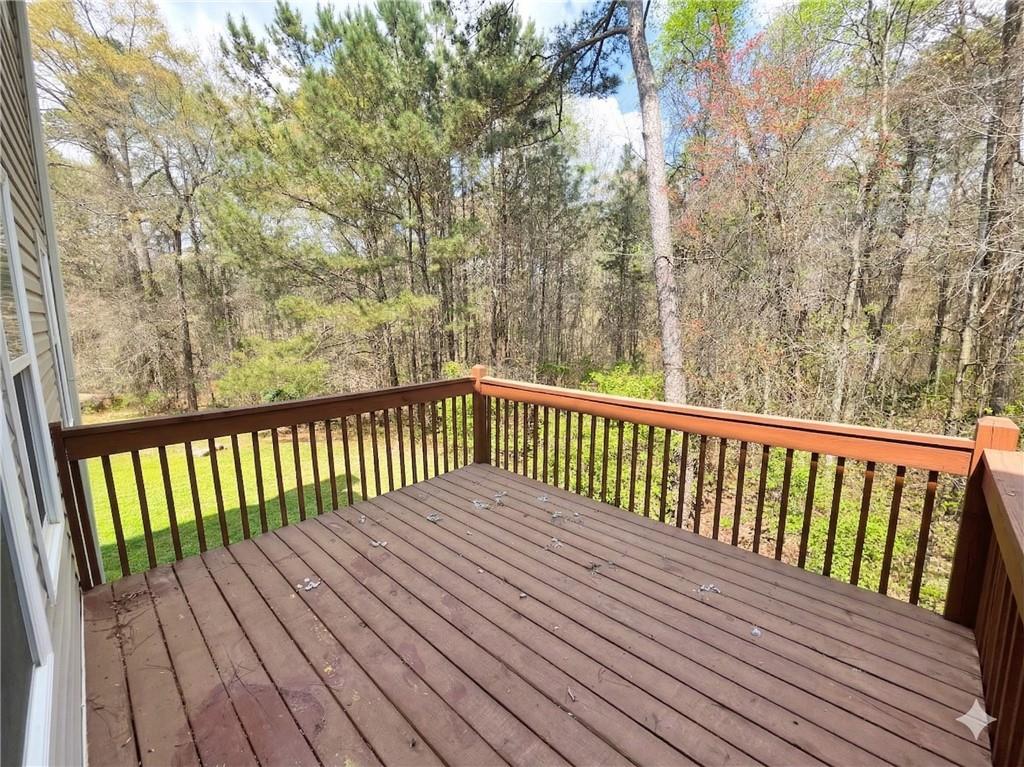 92 Revere Turn Fairburn, GA 30213 - Photo 42 of 42 a balcony with wooden floor and trees