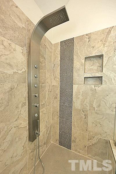 12317 Glenlivet Way Raleigh, NC 27613 - Photo 19 of 25 a bathroom with a shower and a sink