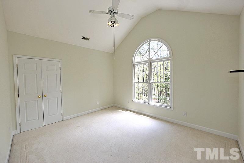 12317 Glenlivet Way Raleigh, NC 27613 - Photo 21 of 25 a view of an empty room with a window