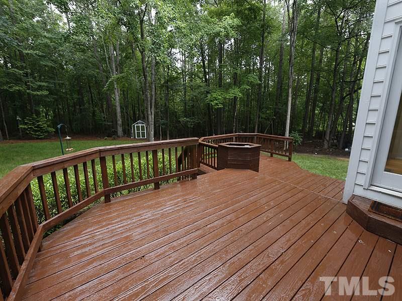 12317 Glenlivet Way Raleigh, NC 27613 - Photo 22 of 25 a view of a wooden deck with furniture