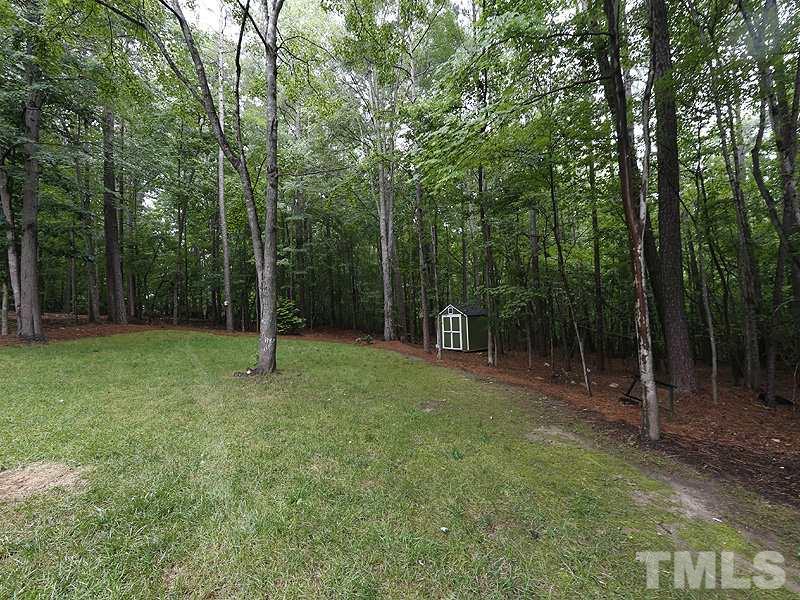 12317 Glenlivet Way Raleigh, NC 27613 - Photo 24 of 25 a view of outdoor space with a garden
