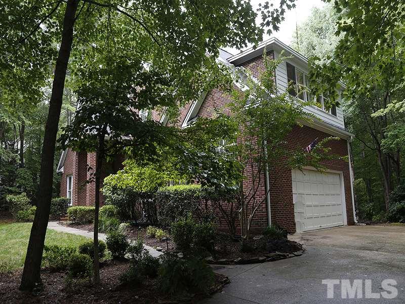 12317 Glenlivet Way Raleigh, NC 27613 - Photo 25 of 25 a backyard of a house with lots of green space