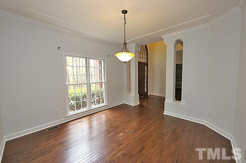 12317 Glenlivet Way Raleigh, NC 27613 - Photo 4 of 25 a view interior room with wooden floor and windows