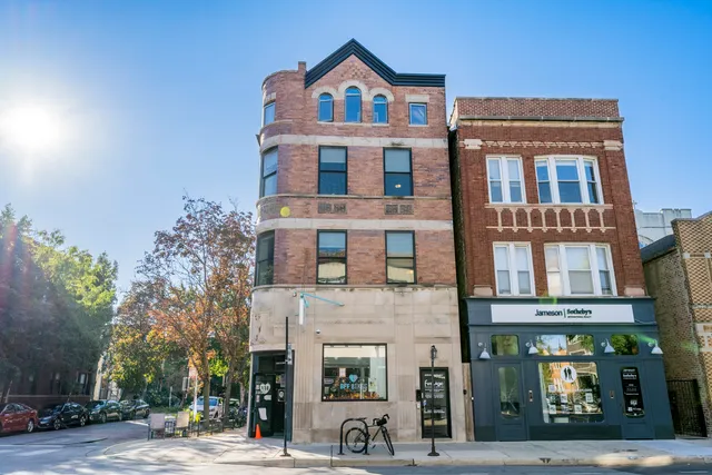 a view of a building with a street