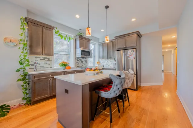 a kitchen with a sink appliances and a counter top space
