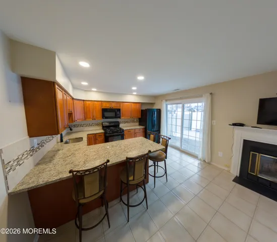 a view of a livingroom with a ceiling fan and window
